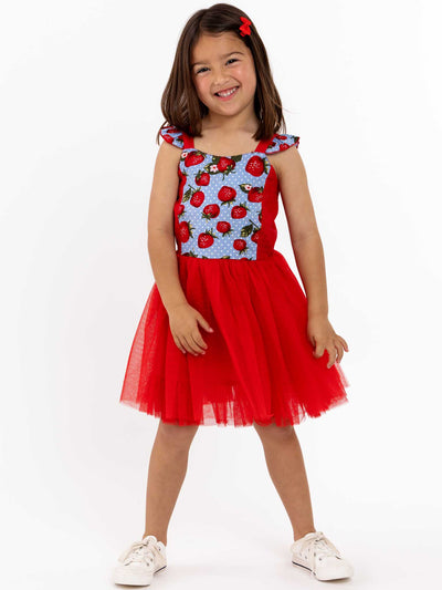 A little girl in a twirl approved Strawberry Fields Belle-inspired tulle dress.