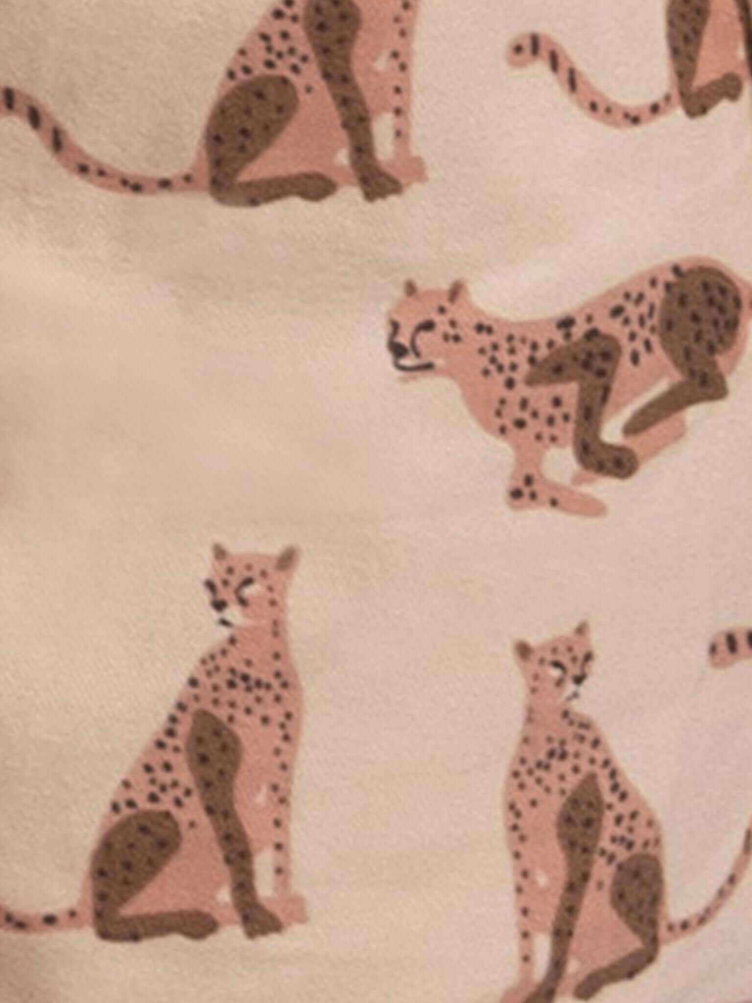 Pattern of leopards on a beige background
