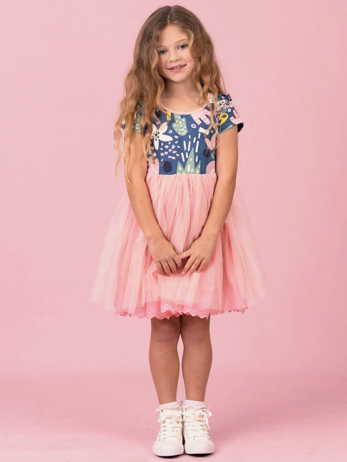 Girl in Navy Jungle Claudia tutu dress with pink tulle skirt