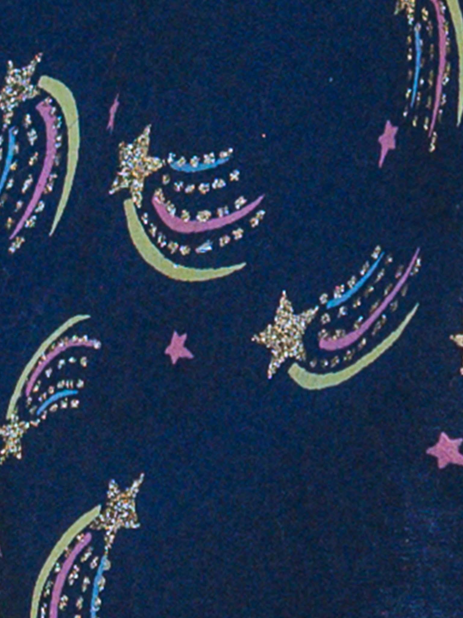 The Oobi Superstar Dress features navy blue cotton-textured fabric with glittery shooting stars, colorful trails, and pink stars—perfect for your little superstar.