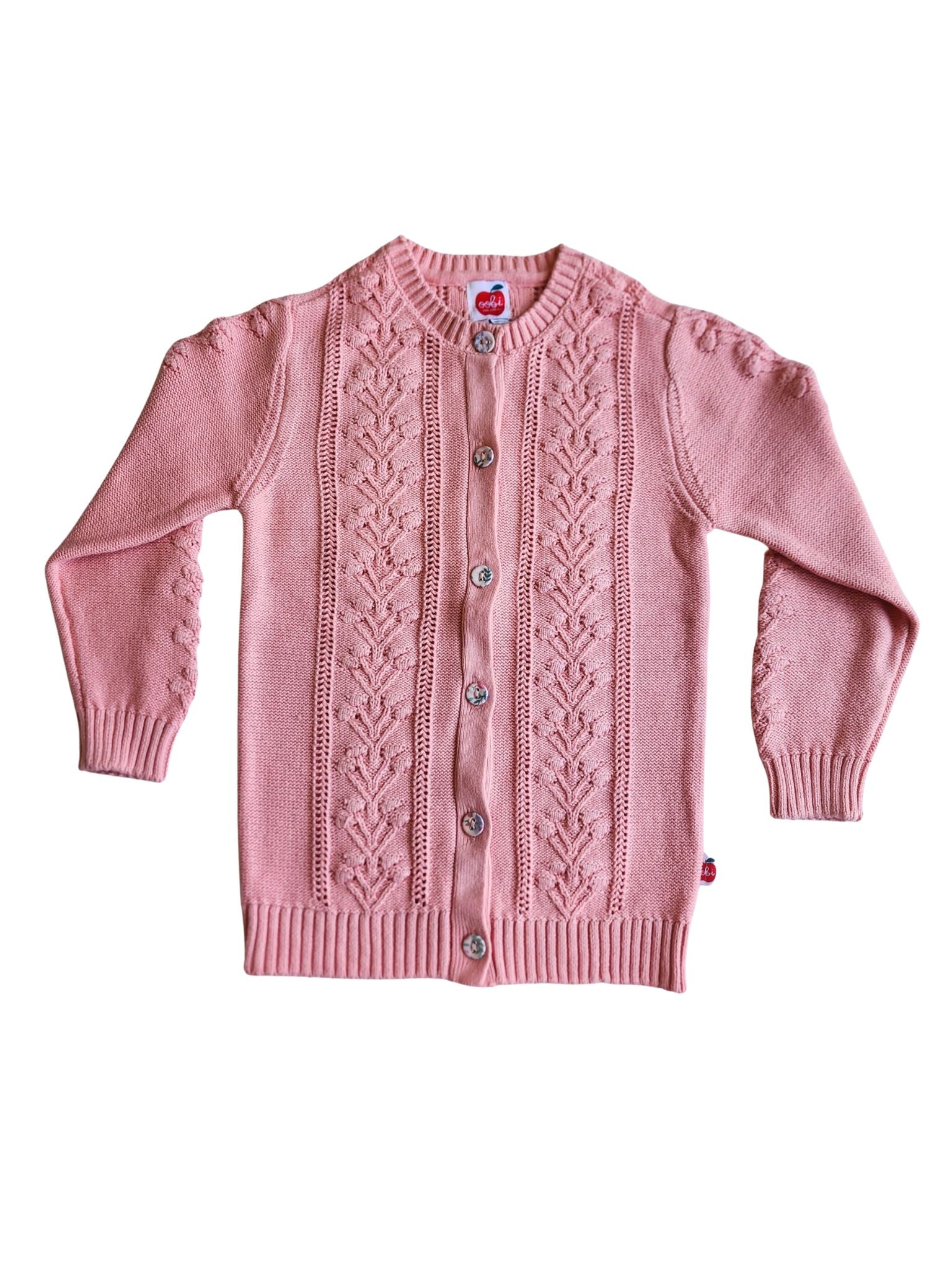 The Floral Cardigan Pretty Pink from Knitwear showcases a chunky knit with a floral design, front buttons, ribbed cuffs, and hem.