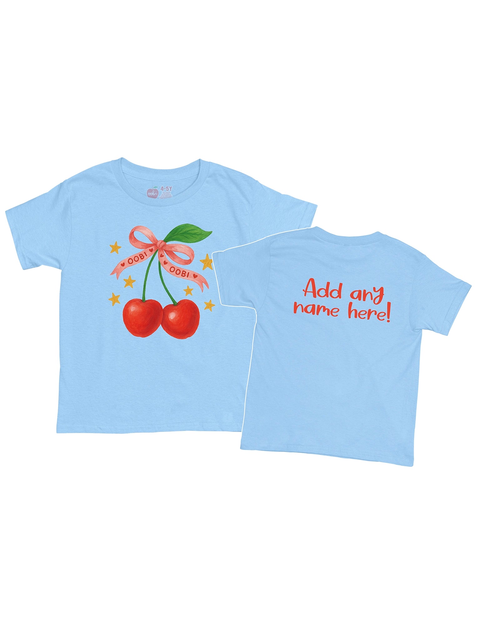 The Essentials Cherry Printed Tee features a light blue design with cherry print, pink "OOBI! OOBI!" ribbon, stars, and is made from 100% cotton. Customizable back text lets you add any name in red.