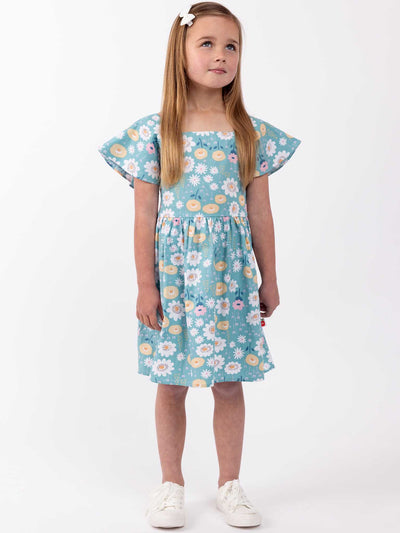 A little girl wearing the Amity Dress Happy Daisies by Happy Daisies.