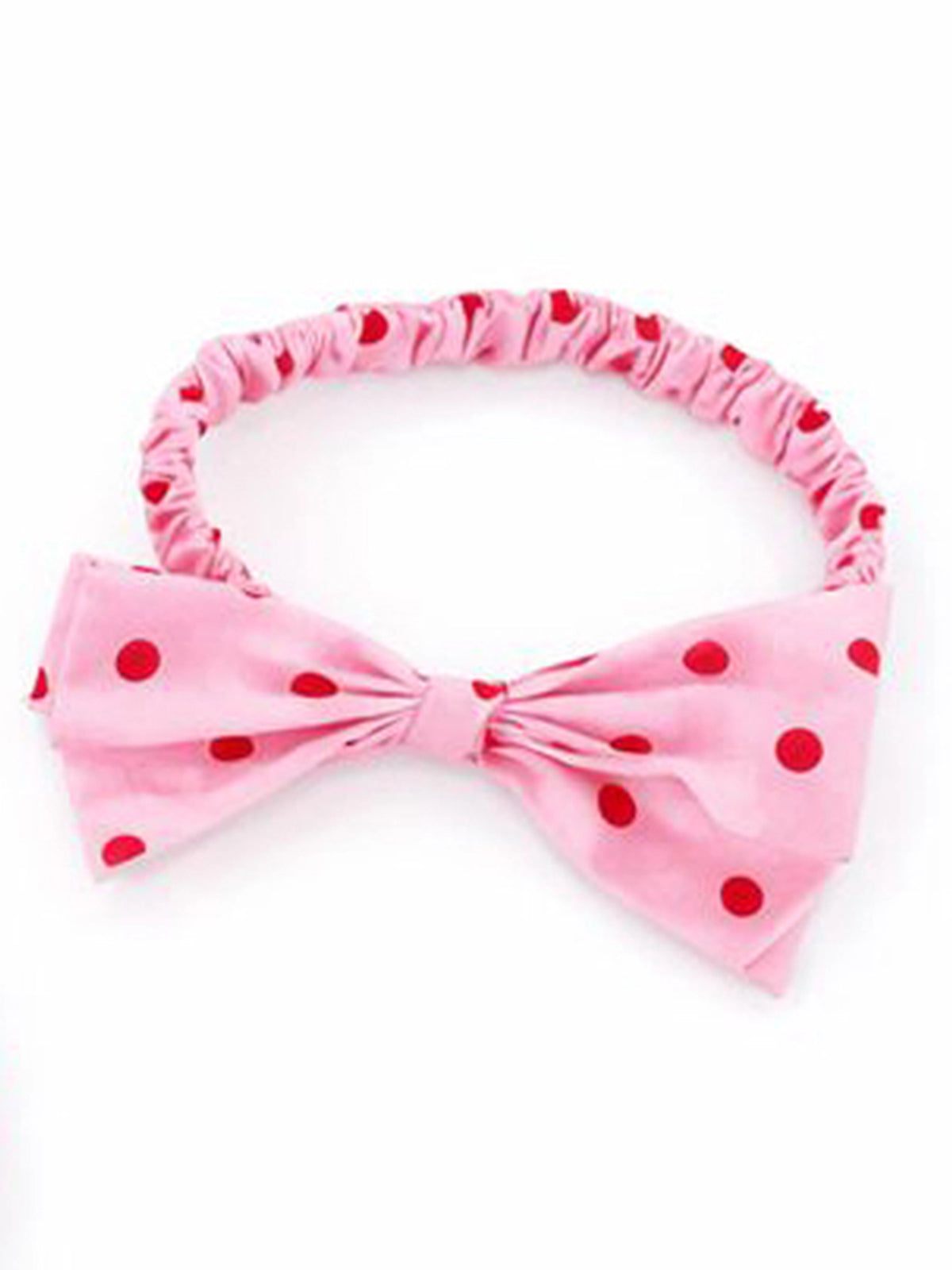 Pink velvet headband with a large bow and red polka dots, shown on a plain white background.