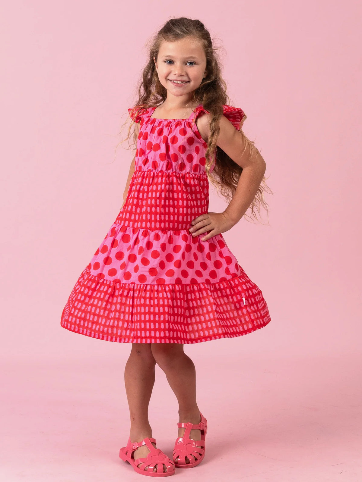 Girl in the Jaipur Block-Print Holiday dress with flutter sleeves
