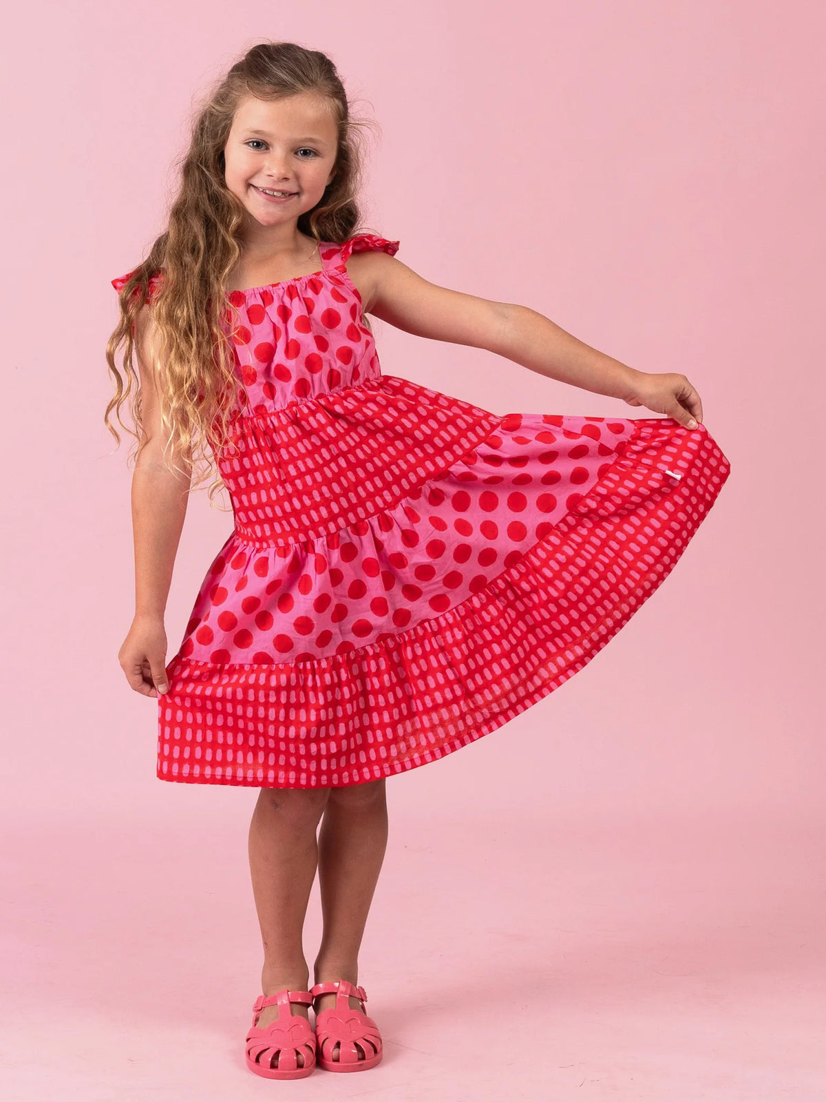 Girl in the Jaipur Block-Print Holiday dress with flutter sleeves