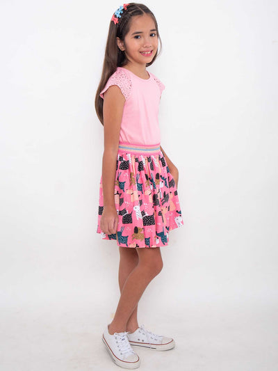A pretty girl in a Doggo Pink Doggo Jersey Skirt posing for a picture.