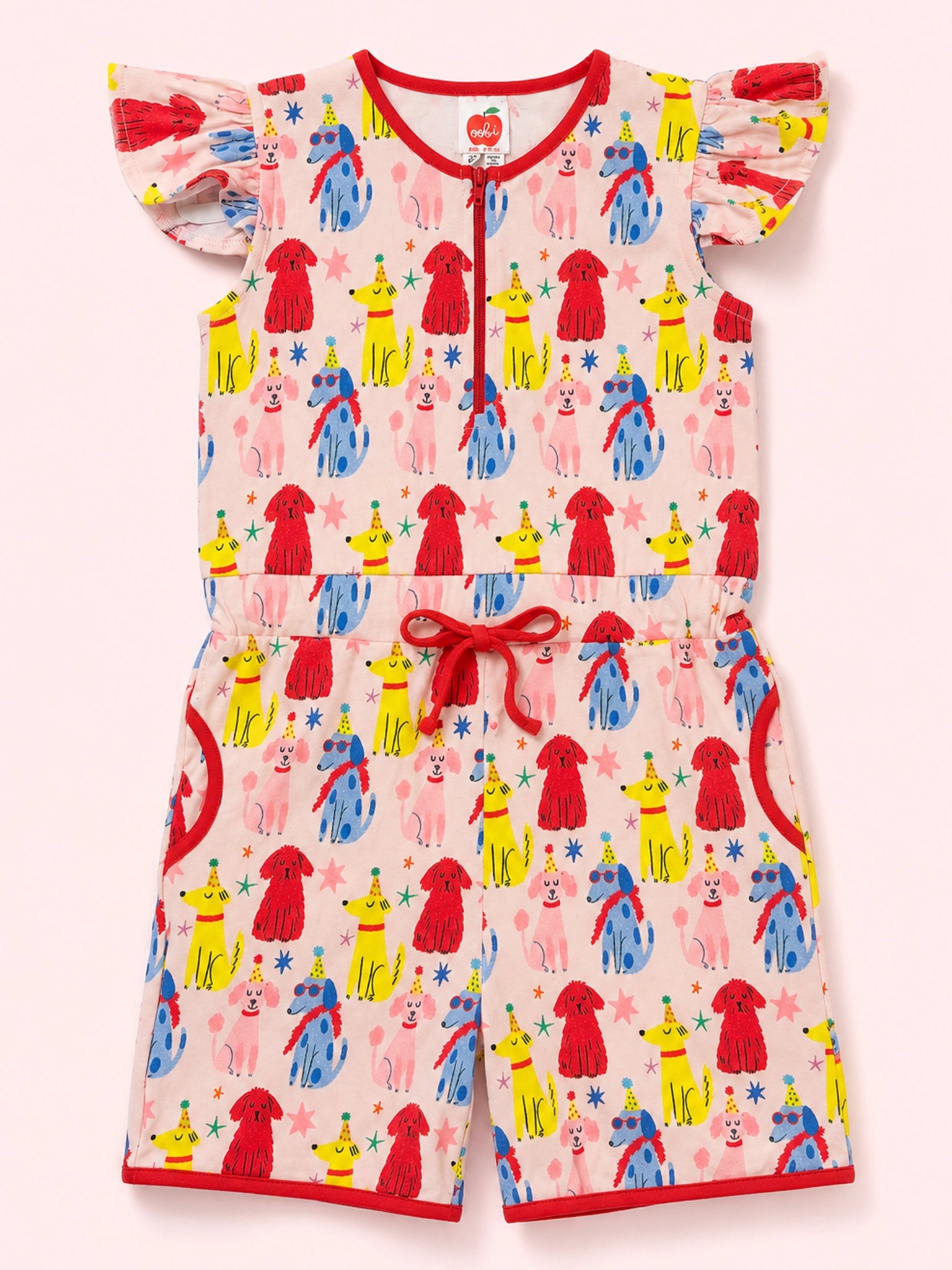 A baby romper with a playful clown pattern featuring red, yellow, and blue figures on a light pink background, finished with red trim and a red drawstring waist.