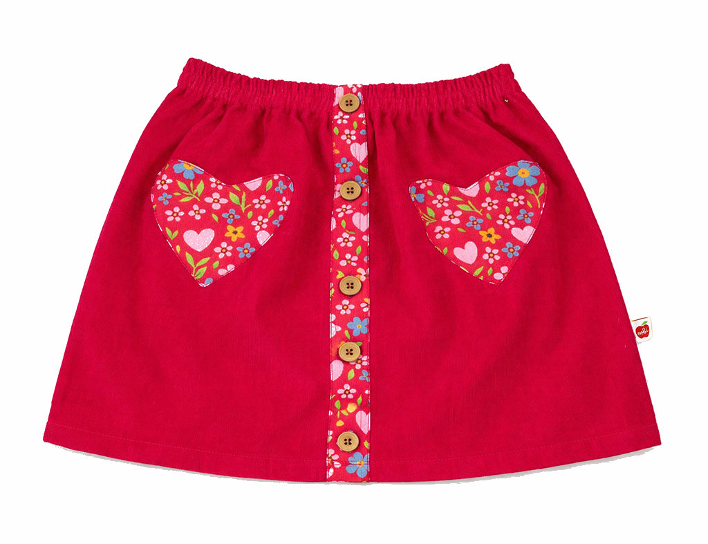 Red skirt with floral heart and butterfly designs on a white background
