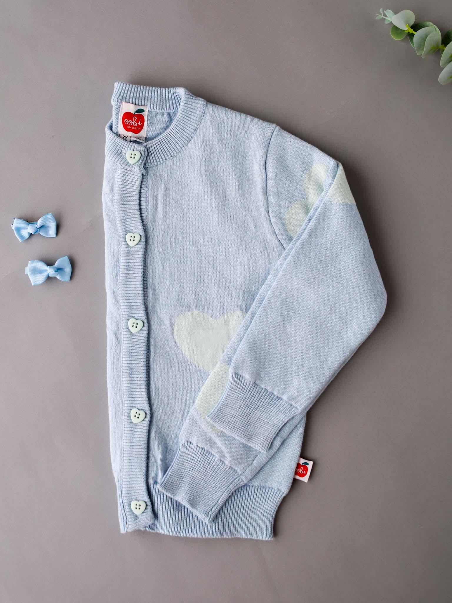 A Maxine Starlight Hearts Cotton Cardigan with heart-shaped buttons.